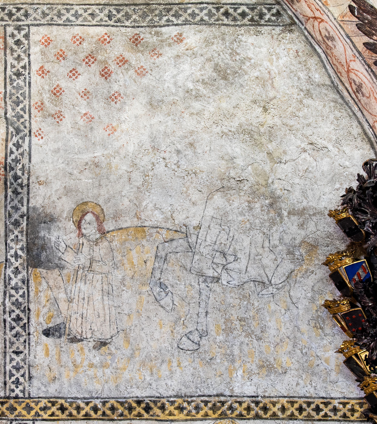 Till vänster en liten figur med gloria, ledd av en större; till höger nedre delen av en häst med en ridande kvinna i veckrik kjol - Knutby kyrka