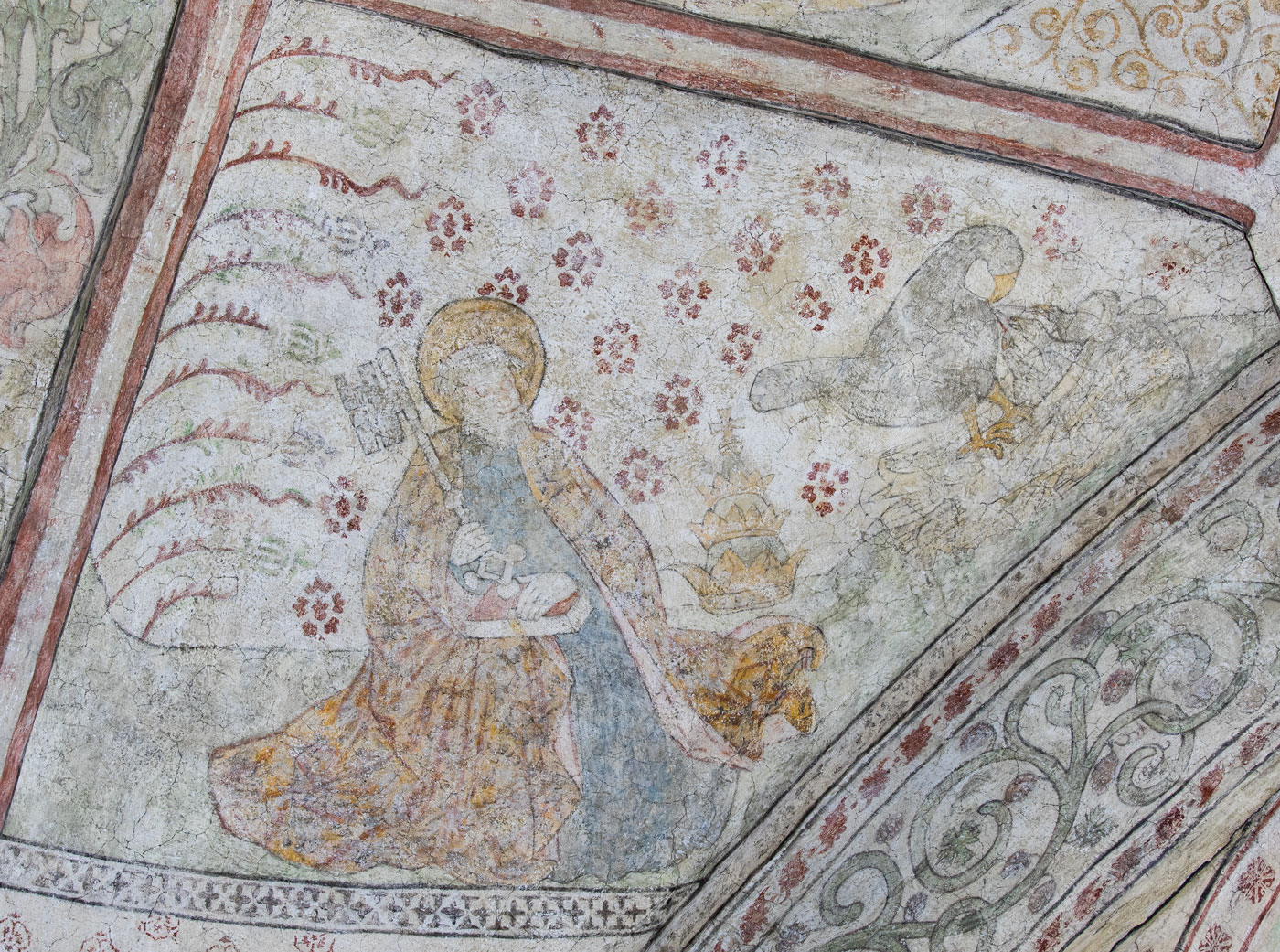 Aposteln Petrus med bok och nyckel. Till höger tiara på marken och Pelikanen, som matar sina ungar med sitt eget blod - Nederluleå kyrka