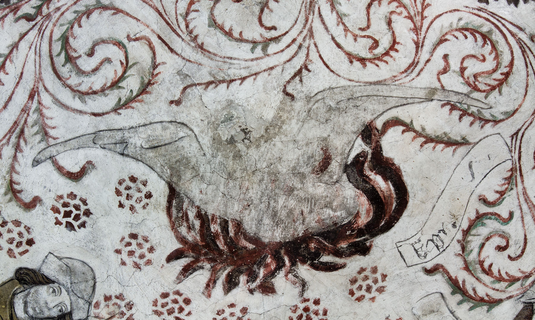 Fågel Fenix i sitt brinnande näste, symbol för Kristi död och uppståndelse, liksom även för bl.a. kyskheten, hoppet och kyrkan - Odensala kyrka