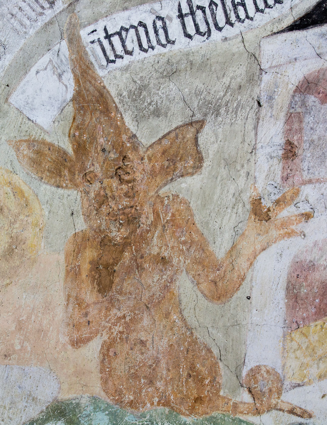 Ars moriendi: Frestelse till avaricia. En djävul pekar på huset (detalj) - Solna kyrka